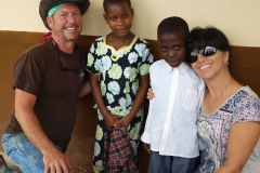 Team members Fred Kampmann and Laurie Slaughter loving on their sponsor children